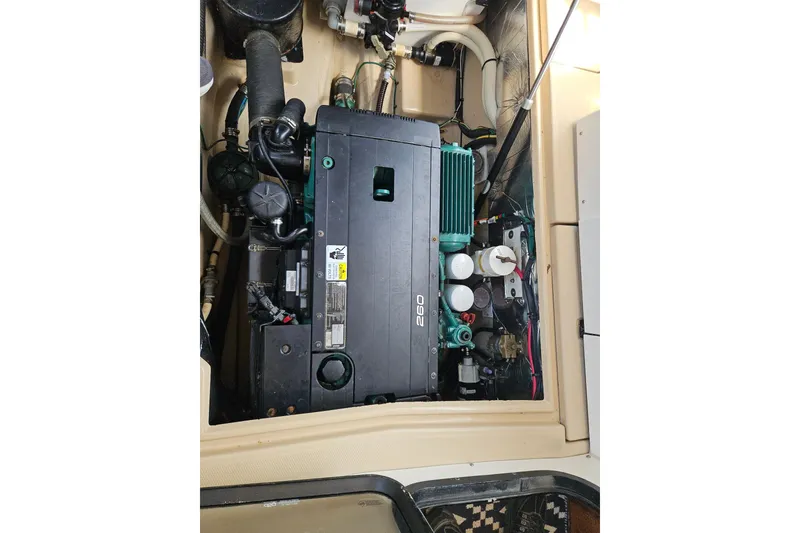 Slide: The Image of Engine compartment of a 2013 Cutwater 28 boat, showcasing mechanical components. - 34