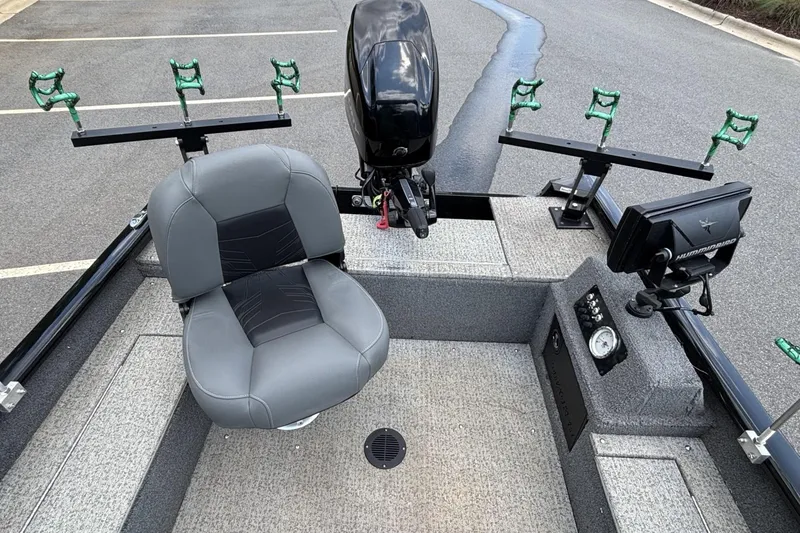 Slide: The Image of 2022 Tracker Super Guide V-16 T fishing boat interior with seating and equipment. - 14