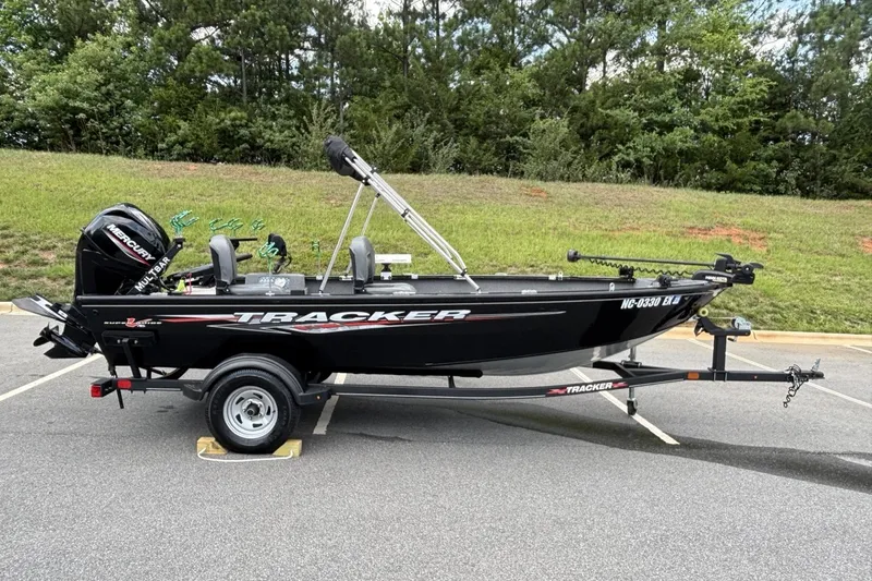 Slide: The Image of 2022 Tracker Super Guide V-16 T boat on trailer, parked outdoors. - 15