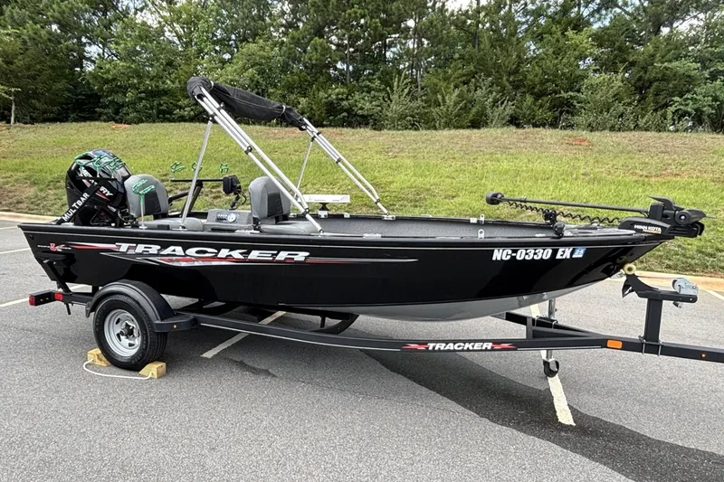 Slide: The Image of 2022 Tracker Super Guide V-16 T boat on trailer in parking lot. - 17