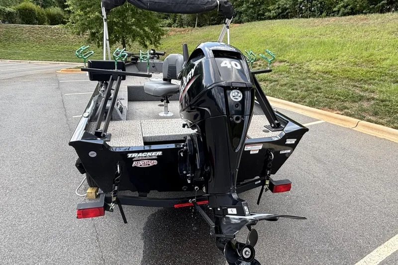 Slide: The Image of 2022 Tracker Super Guide V-16 T boat with Mercury 40 HP engine in parking lot. - 4