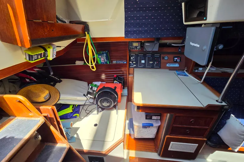 Slide: The Image of Interior of a 1985 C&C 37 sailboat with navigation equipment and storage. - 6