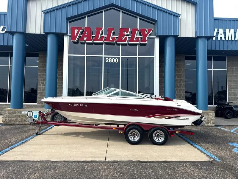 The Image of A 1996 Sea Ray 210 Signature on a trailer in front of a building labeled "Valley." - 1