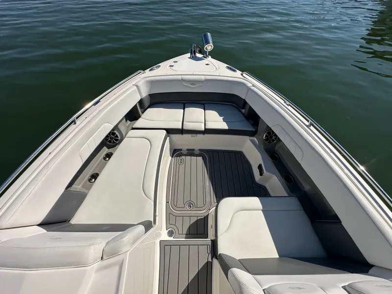 Slide: The Image of The image shows the bow of a 2016 Chaparral 337 SSX boat on the water. - 20