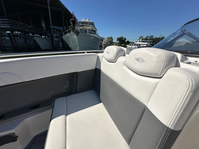 Slide: The Image of The image shows the cockpit of a 2016 Chaparral 337 SSX with white seating. - 22