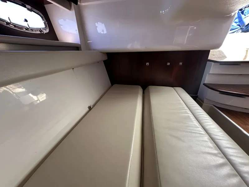 Slide: The Image of Interior of a 2016 Chaparral 337 SSX with beige upholstered seating. - 47