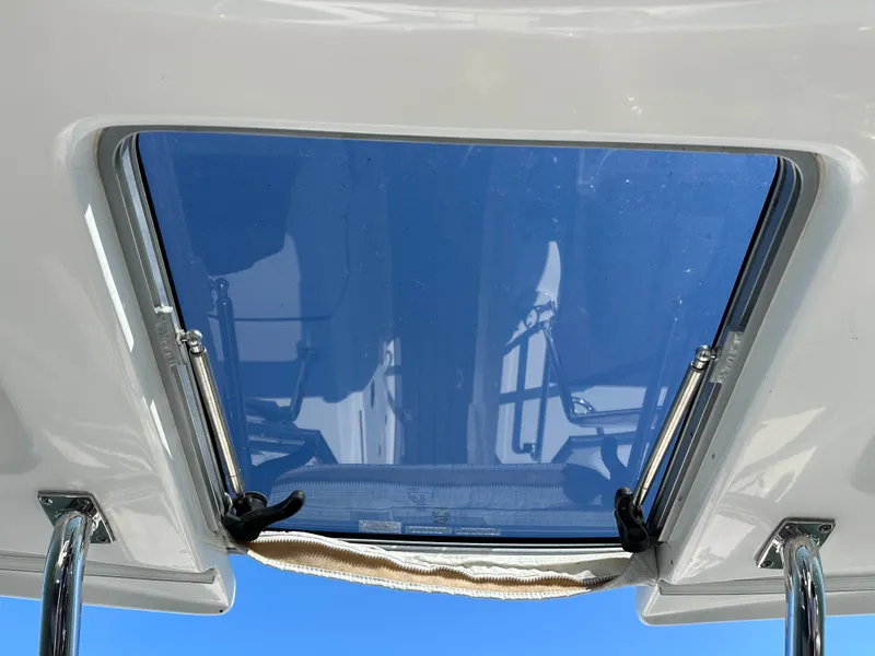 Slide: The Image of A sunroof on a boat with a blue sky in the background. - 48
