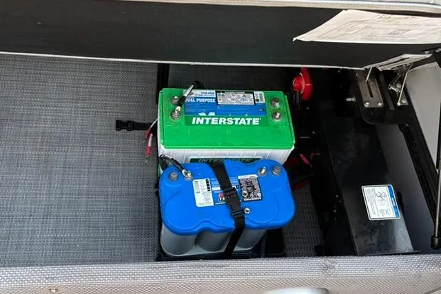 Slide: The Image of Battery compartment of a 2024 Regency 250 DL3 boat with Interstate batteries. - 17