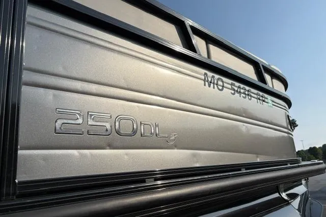 Slide: The Image of 2024 Regency 250 DL3 boat exterior with model branding and registration number. - 20