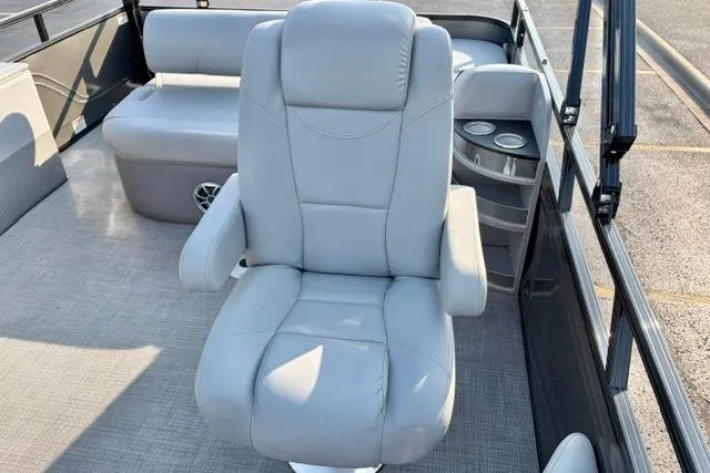 Slide: The Image of Luxurious seating on 2024 Regency 250 DL3 pontoon boat with cup holders and spacious layout. - 30