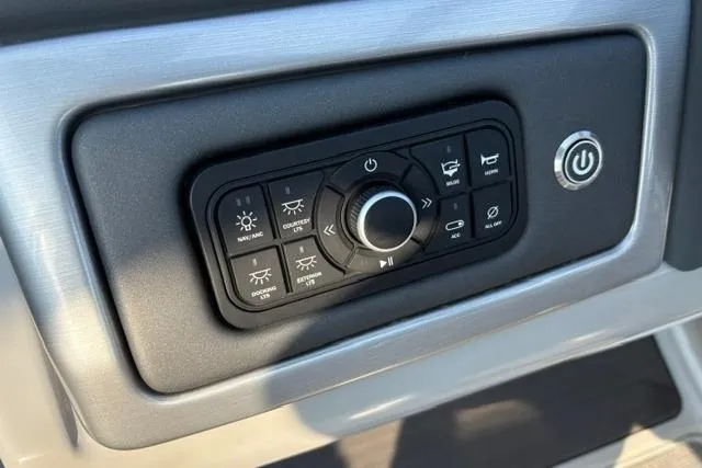 Slide: The Image of Control panel of 2024 Regency 250 DL3 boat with various function buttons. - 31