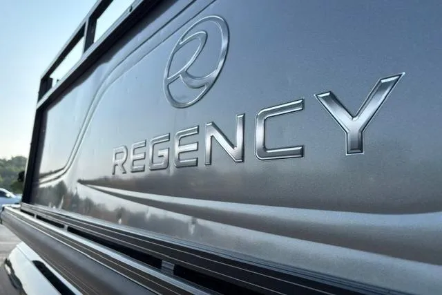 Slide: The Image of 2024 Regency 250 DL3 logo on sleek metallic surface, showcasing modern design. - 35