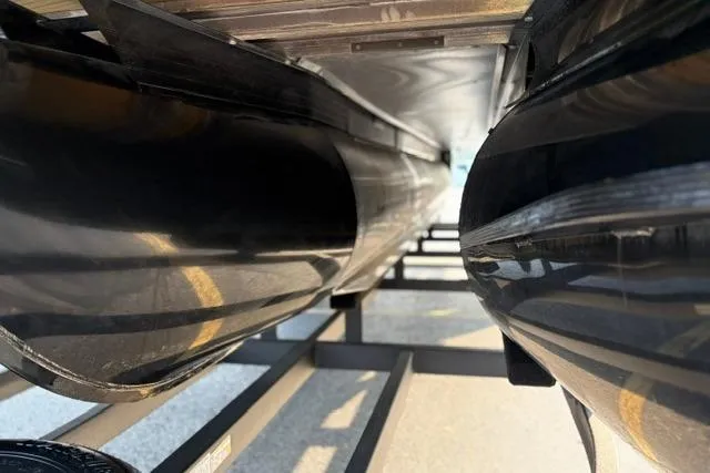 Slide: The Image of 2024 Regency 250 DL3 pontoon boat underside view on trailer. - 40