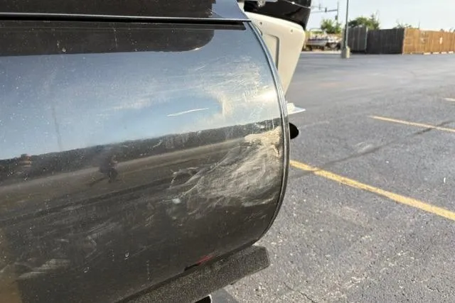 Slide: The Image of 2024 Regency 250 DL3 with visible scratches on the side in a parking lot. - 42