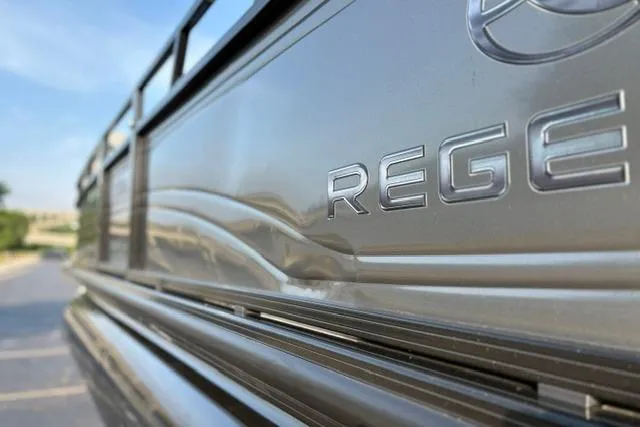 Slide: The Image of 2024 Regency 250 DL3 boat, close-up of sleek metallic exterior design. - 48