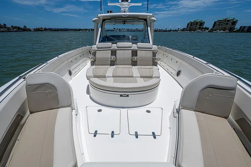 Slide: The Image of 2022 Boston Whaler 420 Outrage boat interior with spacious seating and ocean view. - 23