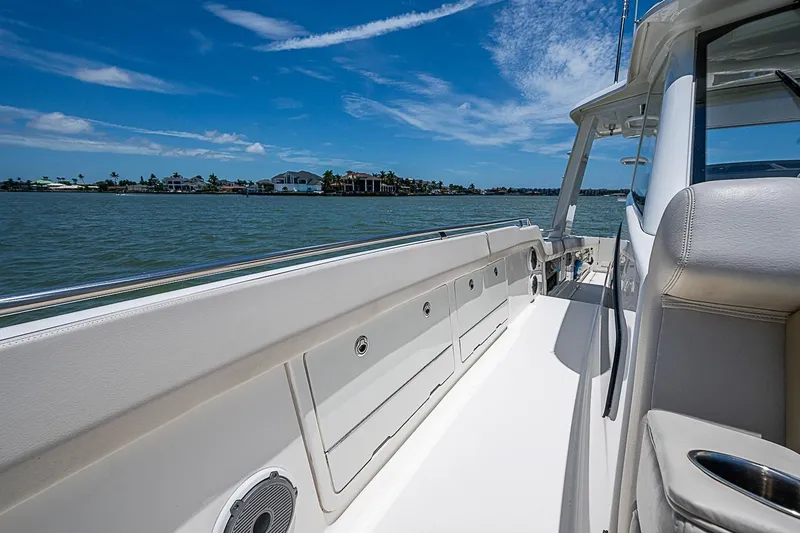 Slide: The Image of 2022 Boston Whaler 420 Outrage boat deck with ocean view and clear blue sky. - 26