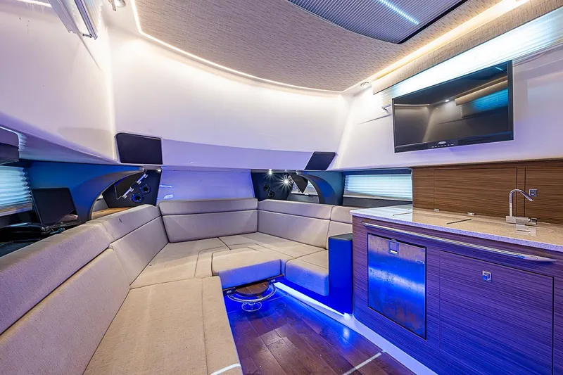 Slide: The Image of Luxurious interior of 2022 Boston Whaler 420 Outrage with modern seating and entertainment system. - 28