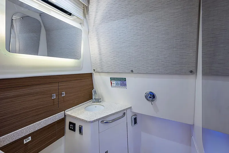 Slide: The Image of Luxurious bathroom interior of 2022 Boston Whaler 420 Outrage boat, featuring modern fixtures. - 32
