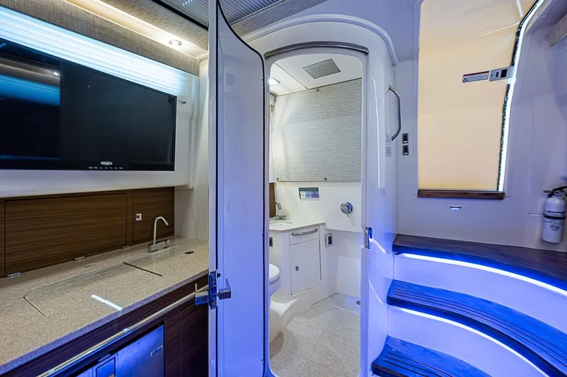 Slide: The Image of Luxurious interior of 2022 Boston Whaler 420 Outrage with modern amenities and sleek design. - 34