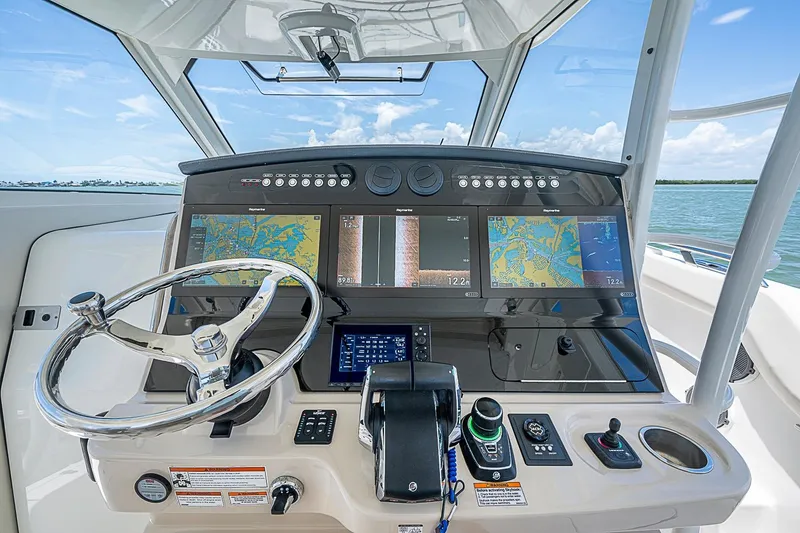 Slide: The Image of Helm of 2022 Boston Whaler 420 Outrage with advanced navigation displays. - 7