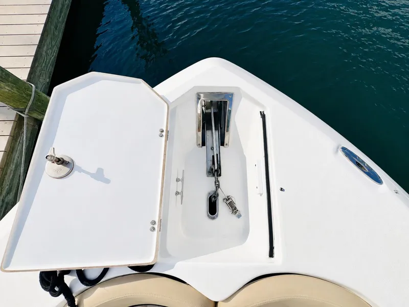 Slide: The Image of The image shows the bow of a 2018 Sea Fox 266 Commander with an open anchor locker. - 13