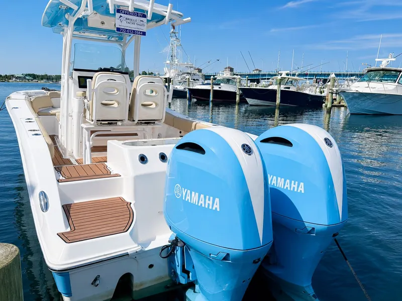 Slide: The Image of 2018 Sea Fox 266 Commander with twin Yamaha outboard engines, docked at a marina. - 30