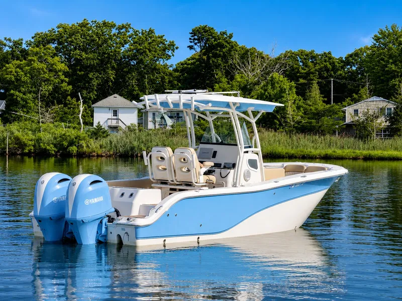 Slide: The Image of A 2018 Sea Fox 266 Commander on calm water with twin Yamaha engines. - 5