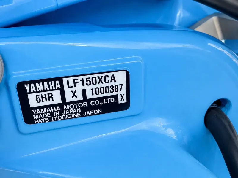 Slide: The Image of Yamaha outboard motor with model number LF150XCA, made in Japan. - 32