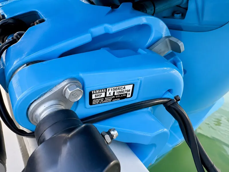 Slide: The Image of Close-up of a blue Yamaha outboard motor on a boat. - 31