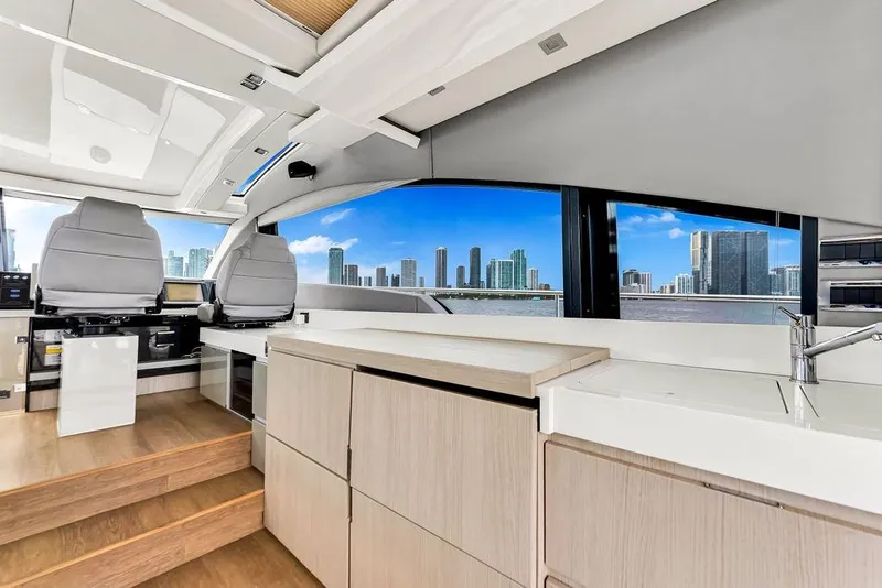 Slide: The Image of Interior of 2012 Fairline Targa 58 yacht with modern design and city skyline view. - 22