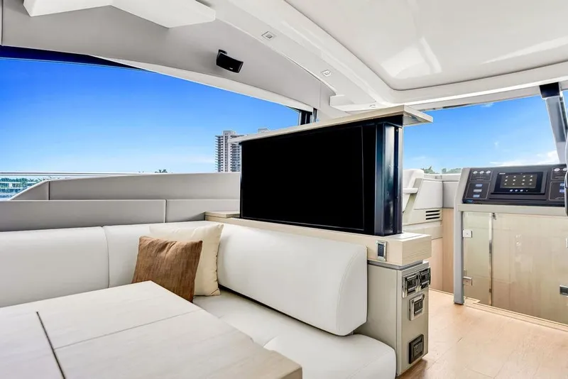 Slide: The Image of Luxurious interior of 2012 Fairline Targa 58 yacht with modern seating and retractable TV. - 23