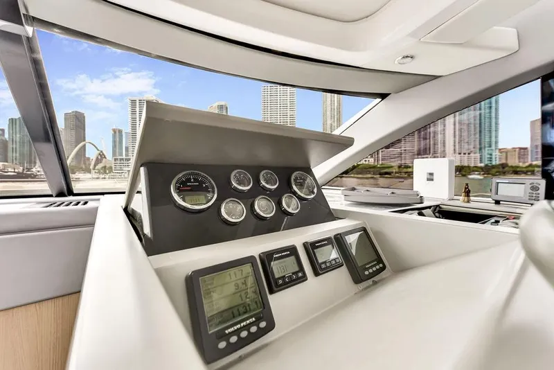 Slide: The Image of Interior view of 2012 Fairline Targa 58 yacht dashboard with city skyline background. - 40