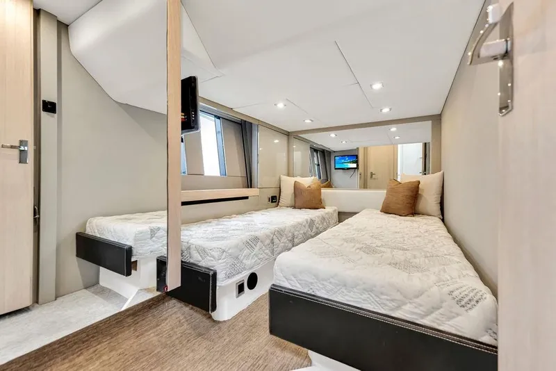 Slide: The Image of Luxurious twin cabin interior of 2012 Fairline Targa 58 yacht, featuring modern design and comfort. - 44