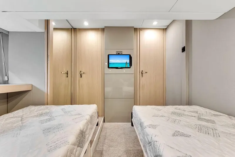 Slide: The Image of Luxurious twin cabin interior of 2012 Fairline Targa 58 yacht with modern decor. - 49