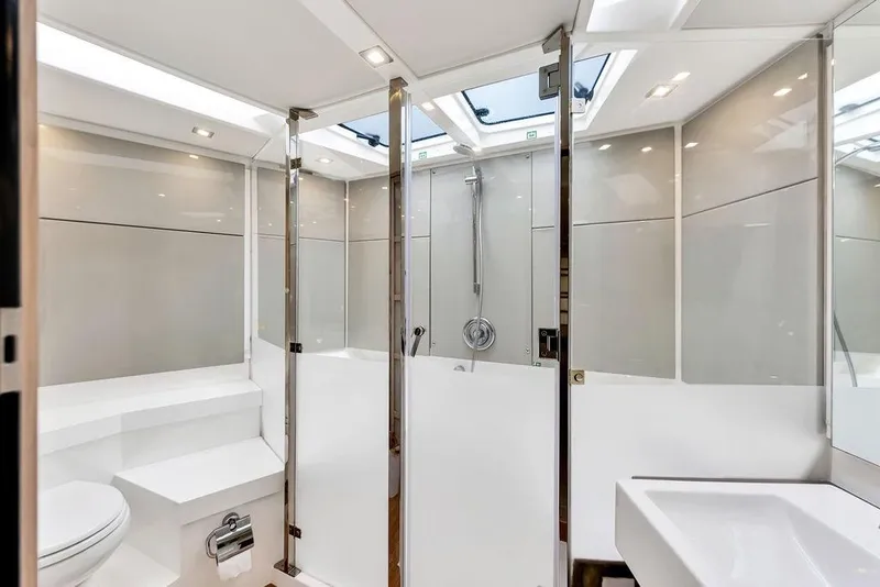 Slide: The Image of Luxurious bathroom interior of 2012 Fairline Targa 58 yacht with modern fixtures and skylight. - 58