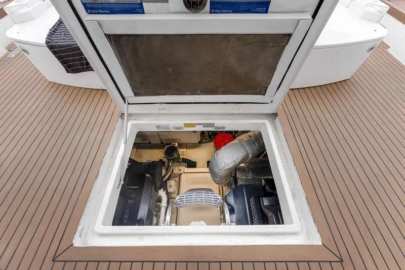 Slide: The Image of Engine compartment of 2012 Fairline Targa 58 yacht, showcasing mechanical components. - 62