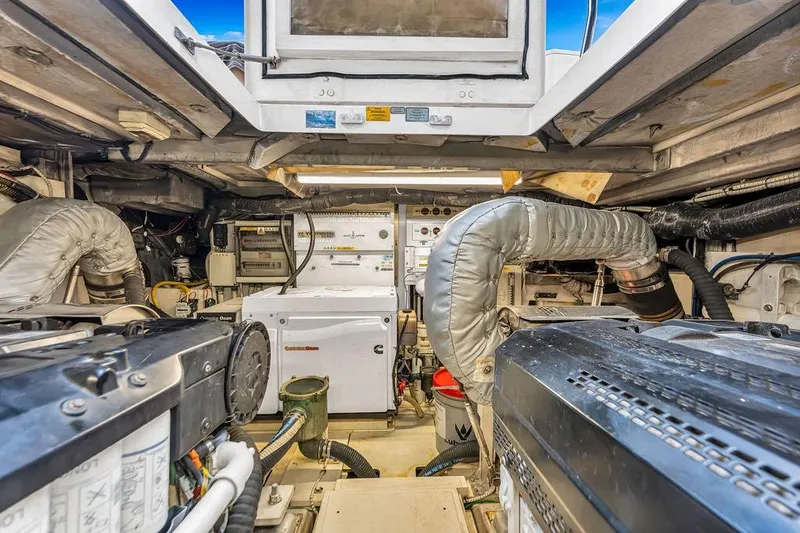 Slide: The Image of Engine room of 2012 Fairline Targa 58 yacht, showcasing machinery and equipment. - 65