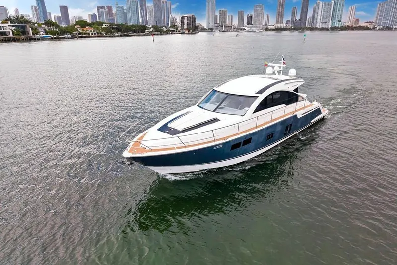 Slide: The Image of Luxury 2012 Fairline Targa 58 yacht cruising near city skyline. - 8