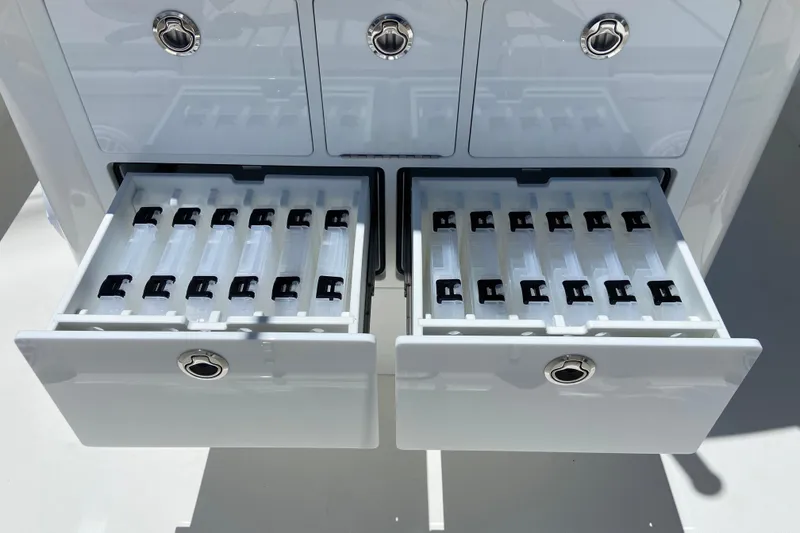 Slide: The Image of Storage drawers on a 2027 Regulator 30XO boat, featuring organized compartments. - 16
