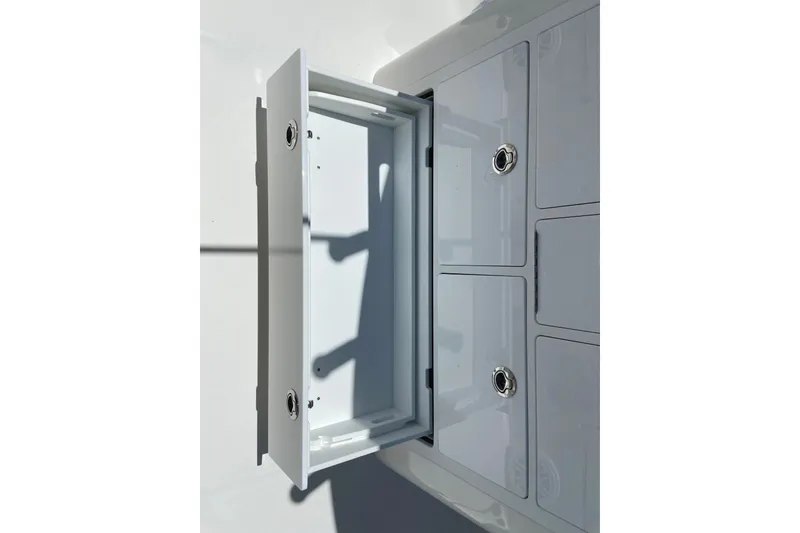 Slide: The Image of Open storage compartment on a 2027 Regulator 30XO boat, showcasing sleek design. - 17