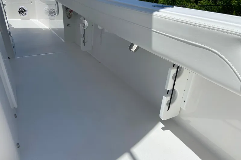 Slide: The Image of 2027 Regulator 30XO boat interior with sleek white design and modern features. - 18
