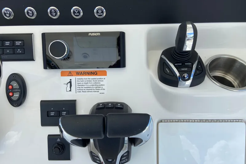 Slide: The Image of Control panel of a 2027 Regulator 30XO boat featuring navigation and control systems. - 30