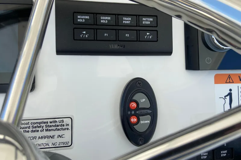Slide: The Image of Control panel of 2027 Regulator 30XO boat with Yamaha navigation buttons. - 31