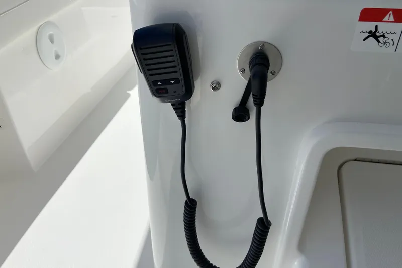 Slide: The Image of Microphone and connector on 2027 Regulator 30XO boat dashboard. - 32