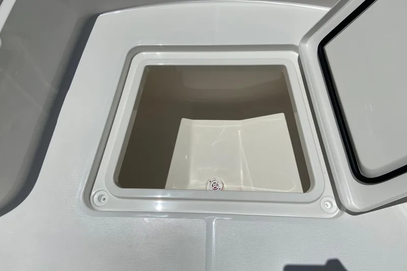 Slide: The Image of Open storage compartment on 2027 Regulator 30XO boat deck. - 41