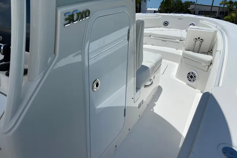 Slide: The Image of 2027 Regulator 30XO boat interior with seating and storage compartments. - 49