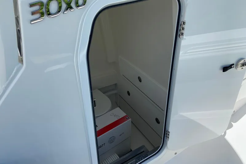 Slide: The Image of 2027 Regulator 30XO boat cabin interior with storage compartments. - 50