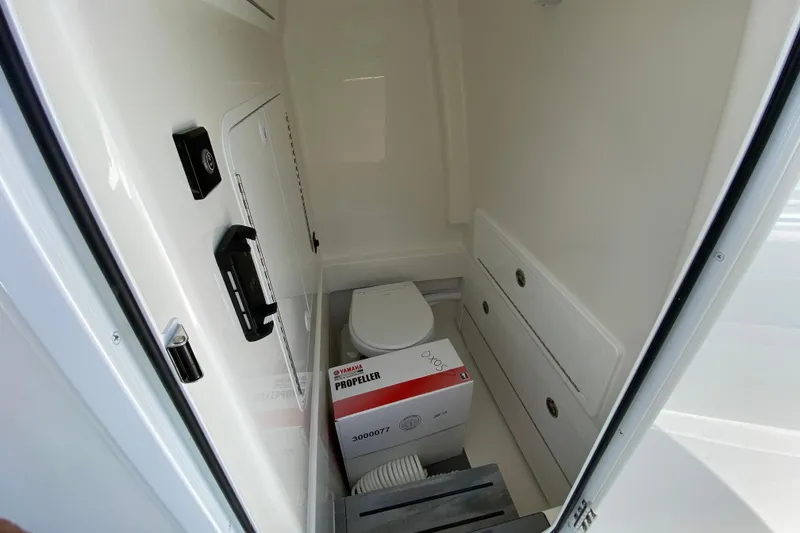 Slide: The Image of Interior of 2027 Regulator 30XO boat with storage and Yamaha propeller box. - 51