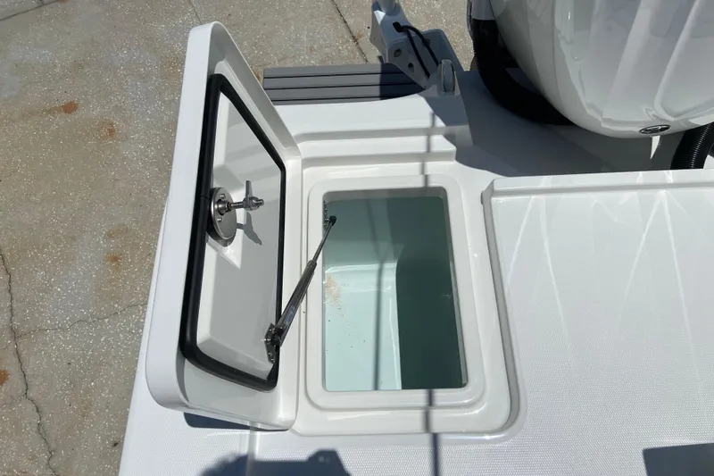 Slide: The Image of Open storage compartment on 2027 Regulator 30XO boat deck. - 6